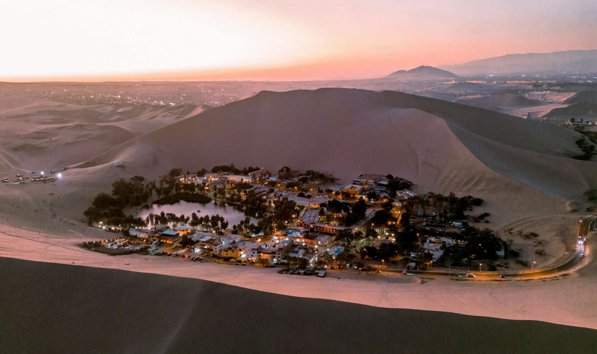 - Exploring Peru’s Travel Gems: A Journey Through Nine Must-Visit Destinations Dusk at the oasis Huacachina lagoon in Peru. Pic by Ed Wingate -unsplash.
