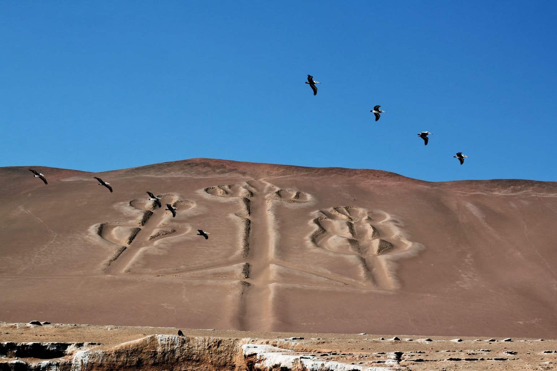- Exploring Peru’s Travel Gems: A Journey Through Nine Must-Visit Destinations Paracas Candelabra, a mysterious geoglyph etched into the desert floor. Pic by Peru Grand Travel.