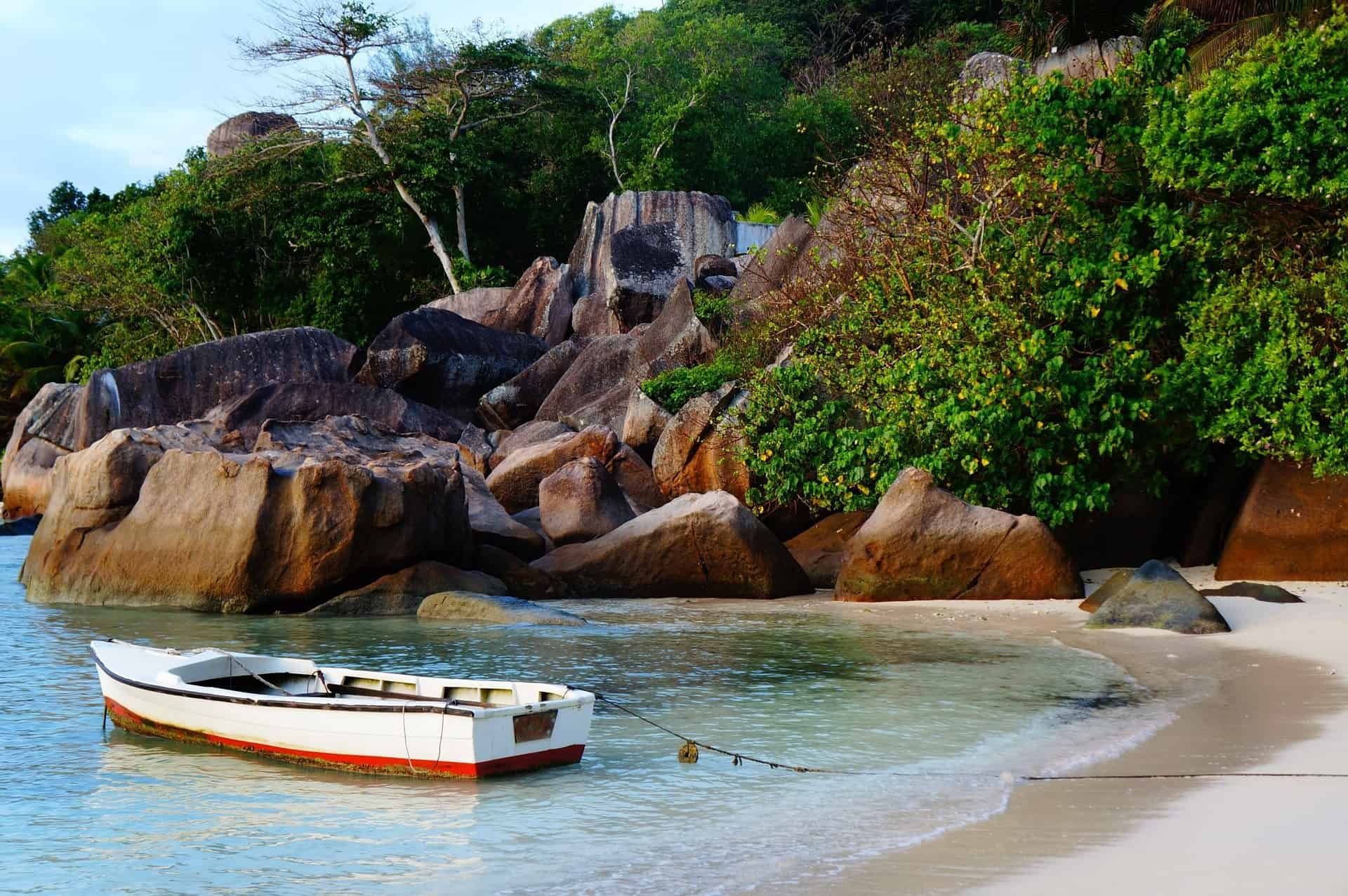 things to do in the seychelles - Top Things to do in the Seychelles Small boat at a beach of Mahé Island, Seychelles.