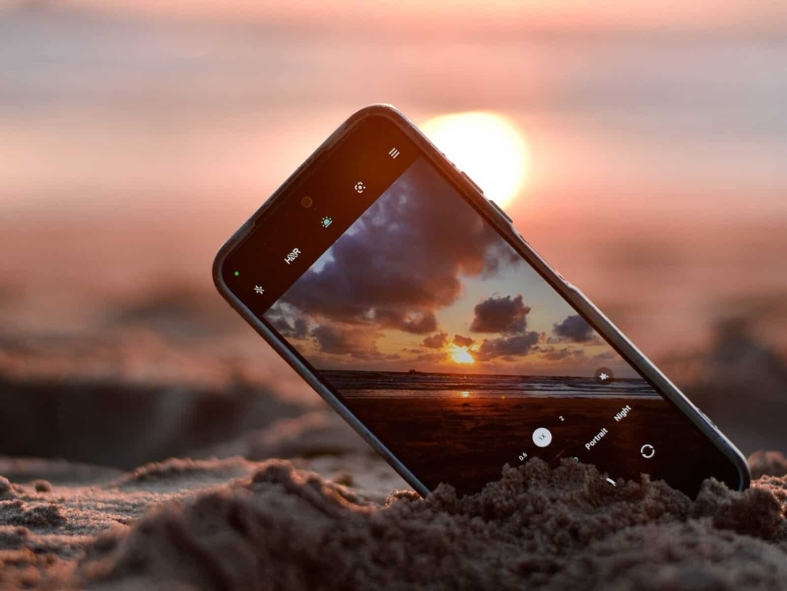 - Stay Connected in Croatia: Why SimLocal's eSIM is the Smart Traveler's Choice Taking a sunset photo at the beach.