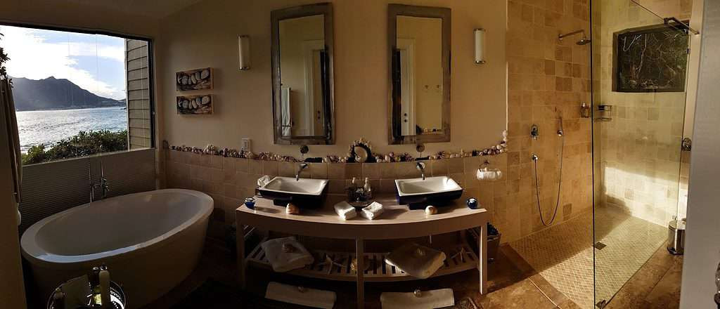 Bathroom with view to the sea at the Tintswalo Atlantic in Hout Bay, Cape Town, South Africa