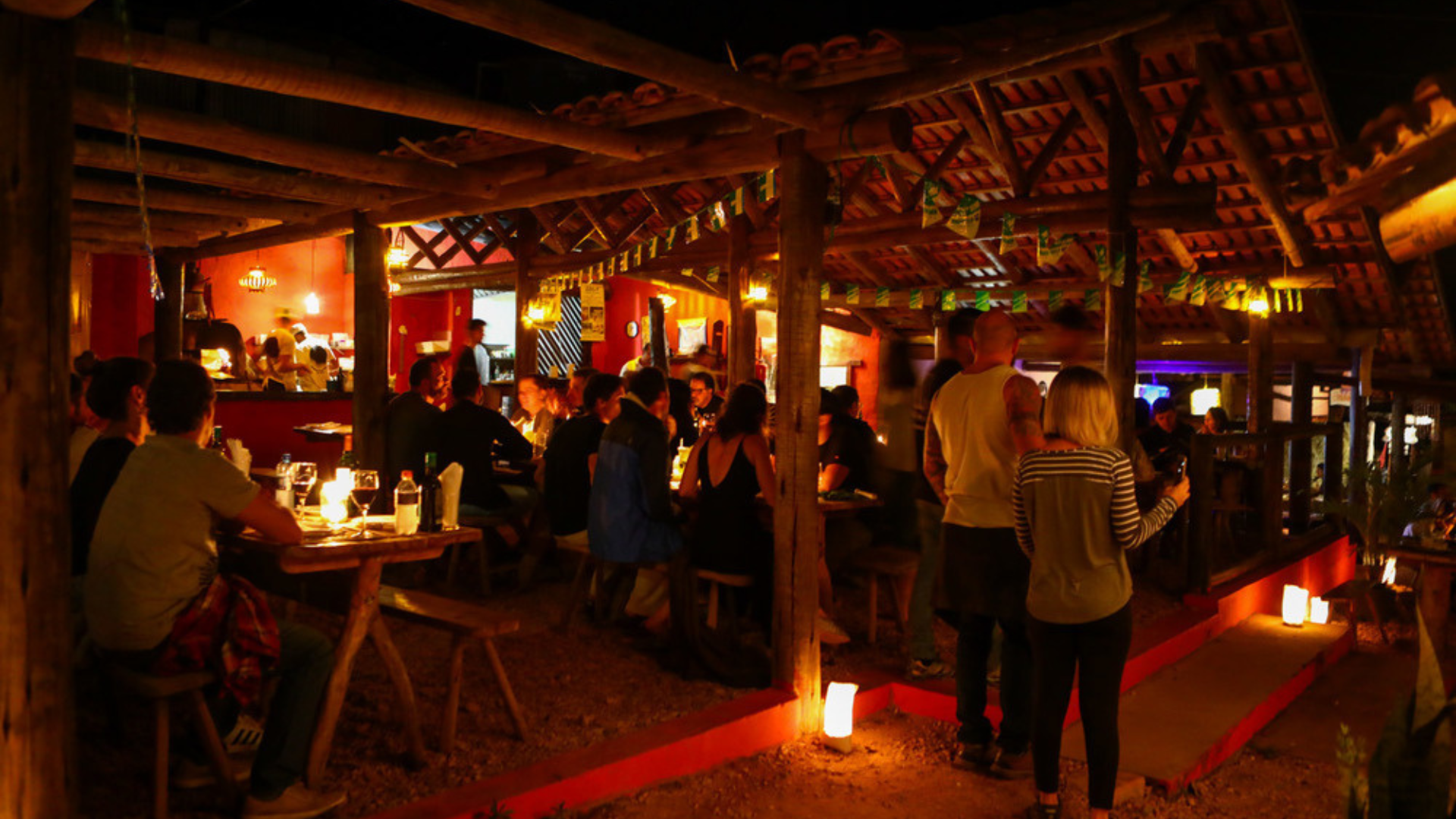 São Jorge - São Jorge, Brazil: Nature & Trails in Chapada dos Veadeiros Cozy restaurant scene with dim lighting and people dining.
